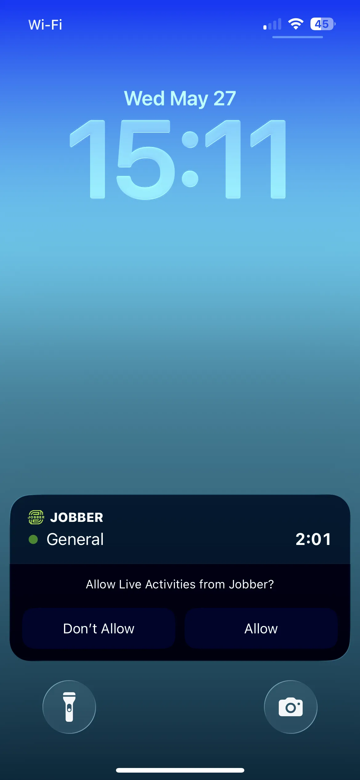 A screenshot showing a live activities box on the lock screen in iOS, including the request to allow it to appear. 